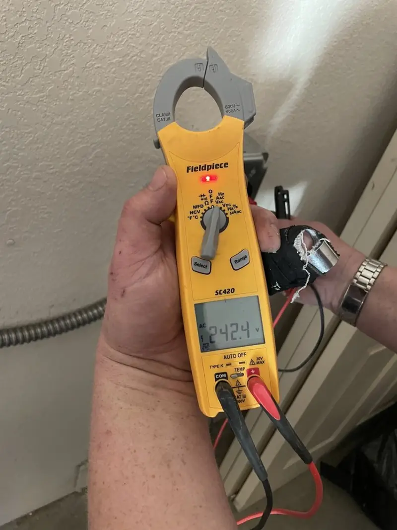 Voltage testing with clamp meter during Generator Installation in Northwood